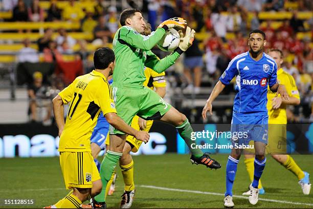 Goalkeeper Andy Gruenebaum of the Columbus Crew gains control of the ball off a Montreal Impact corner kick in the second half on September 1, 2012...