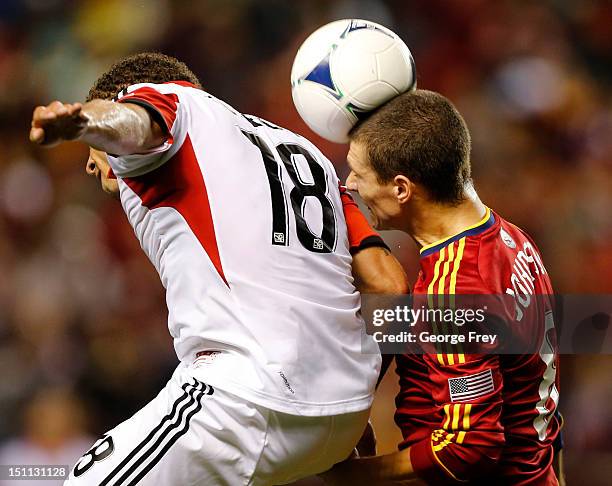 Will Johnson of Real Salt Lake heads the ball over Nick DeLeon of DC United during the second half of an MLS soccer game September 1, 2012 at Rio...