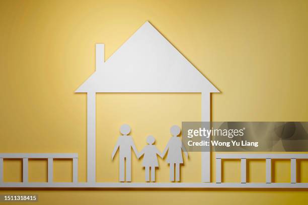 family with home. paper cut effect on yellow background, 3d render - family portrait 3d stockfoto's en -beelden
