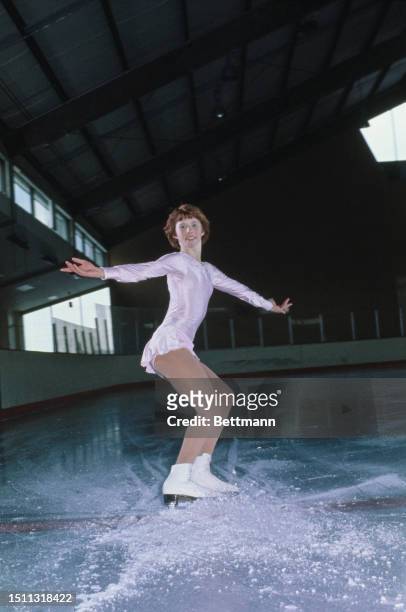 Figure skater Tracy Doyle strikes a pose at an ice rink in Port Washington, New York, December 4th 1976. The teenager sticks to a gruelling practice...