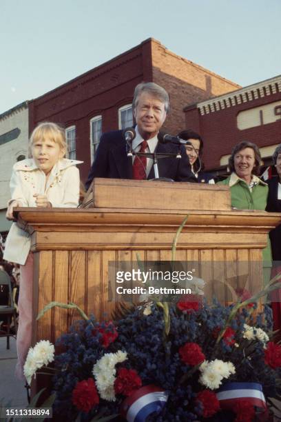 President-elect Jimmy Carter addresses supporters in Plains, Georgia, with his daughter Amy by his side, November 2nd 1976.