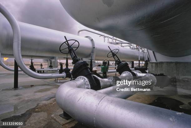 Pipelines carrying oil to the gas-oil separation facilities at Abqaiq, Saudi Arabia, 1970.