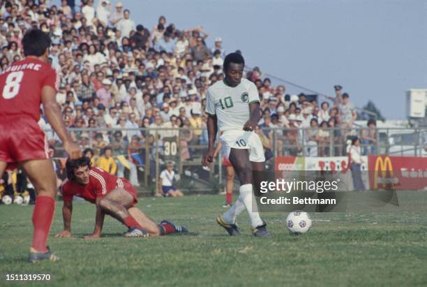 Brazilian footballer Pelé , of New York Cosmos football club, in action against Washington Diplomats at the Robert F Kennedy Stadium in Washington,...