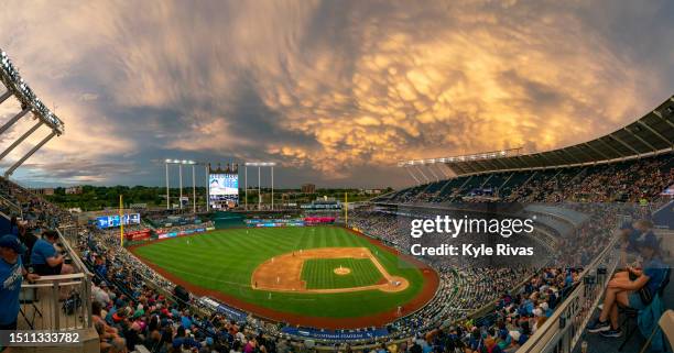 The sky lights up as the Kansas City Royals take on the Los Angeles Dodgers during the third inning at Kauffman Stadium on July 01, 2023 in Kansas...