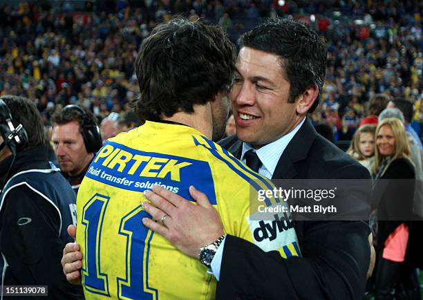 Nathan Hindmarsh of the Eels is congratulated by former Eels player Nathan Cayless after playing in his final NRL match after the round 26 NRL match...