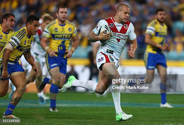 Dan Hunt of the Dragons makes a break during the round 26 NRL match between the Parramatta Eels and the St George Illawarra Dragons at ANZ Stadium on...