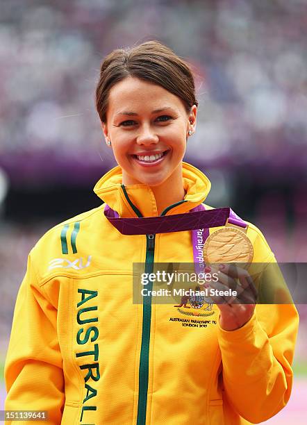 Gold medalist Kelly Cartwright of Australia poses on the podium during the medal ceremony for the Women's Long Jump - F42/44 Final on day 4 of the...