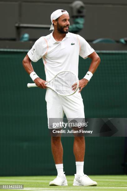 Laurent Lokoli of France reacts against Casper Ruud of Norway in the Men's Singles first round match during day one of The Championships Wimbledon...