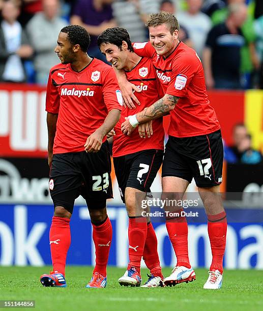 Peter Whittingham celebrates his third goal for Cardiff City with Aron Gunnarsson and Nicky Maynard during the npower Championship match between...