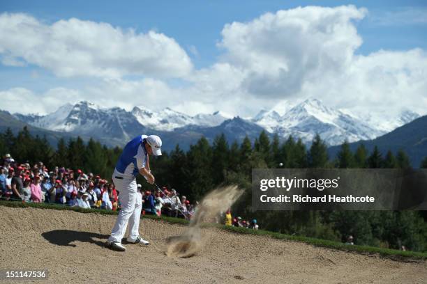 Richie Ramsay of Scotland plays from a fairway bunker on the 12th during final round of the Omega European Masters at Crans-sur-Sierre Golf Club on...