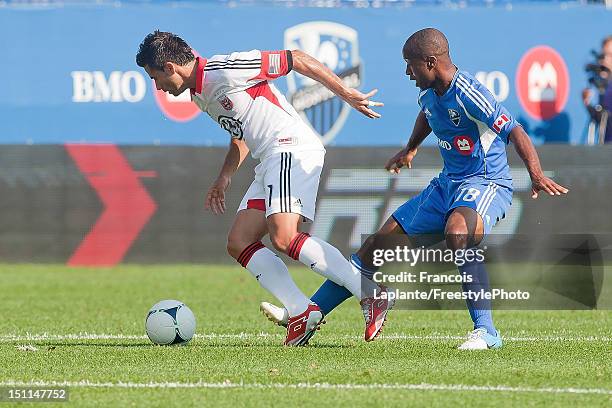 Marcelo Saragosa of the D.C. United controls the ball against Collen Warner of the Montreal Impact during the MLS match at Saputo Stadium on August...