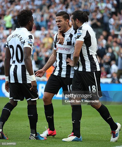 Hatem Ben Arfa of Newcastle United celebrates with Jonas Gutierrez after scoring the equalizing goal during the Barclays Premier League match between...