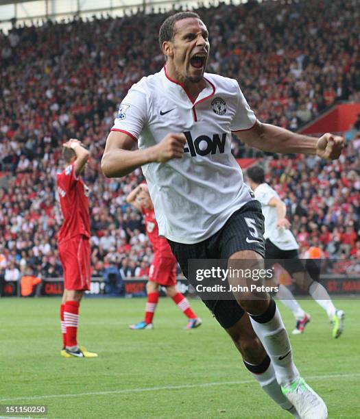 Rio Ferdinand of Manchester United celebrates Robin van Persie scoring their third goal during the Barclays Premier League match between Southampton...