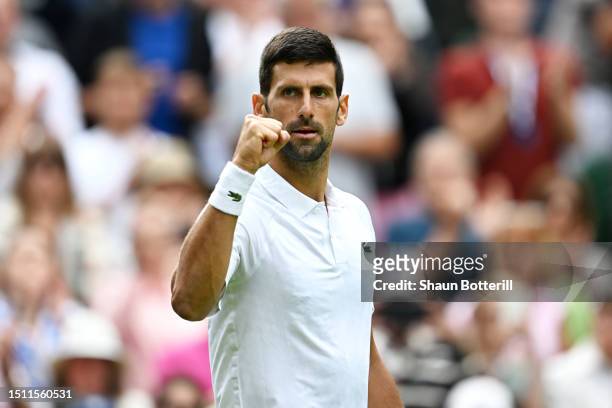 Novak Djokovic of Serbia celebrates winning match point against Pedro Cachin of Argentina in the Men's Singles first round match on day one of The...