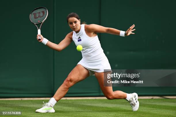 Jodie Burrage of Great Britain plays a forehand against Caty McNally of United States in the Women's Singles first round match on day one of The...