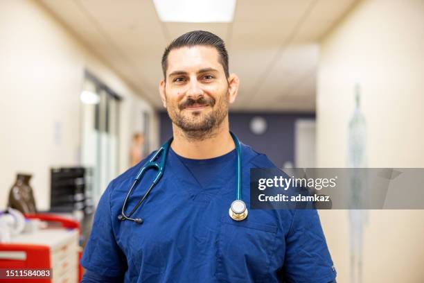 portrait of a male nurse - male nurse stock pictures, royalty-free photos & images