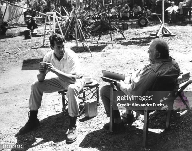 Actors Rock Hudson and Burl Ives chatting at the set film 'The Spiral Road' at Paramaribo, Suriname, in 1961.