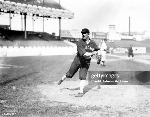 View of baseball player Eddie Cicotte, pitcher for the Chicago White Sox, as he warms up before a game against the New York Giants, New York, New...