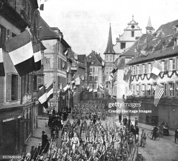 'Notre entrée a Colmar; Le defile des troupes francaises dans les rues pittoresques de la ville, le 22 novembre 1918', 1918. From "L'Album de la...