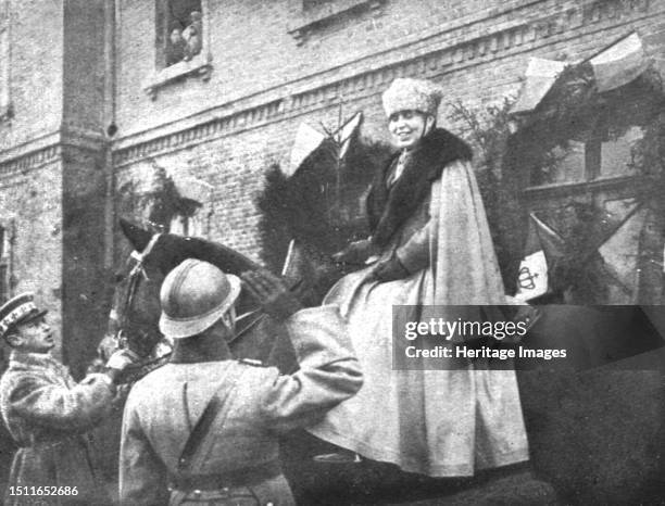 'En Roumanie Liberee; La reine Marie, a cheval et en tenue de general, est saluee par un officier', 1918. From "L'Album de la Guerre 1914-1919,...