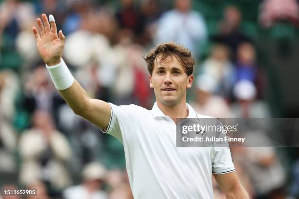 Casper Ruud of Norway celebrates winning match point against Laurent Lokoli of France in the Men's Singles first round match during day one of The...