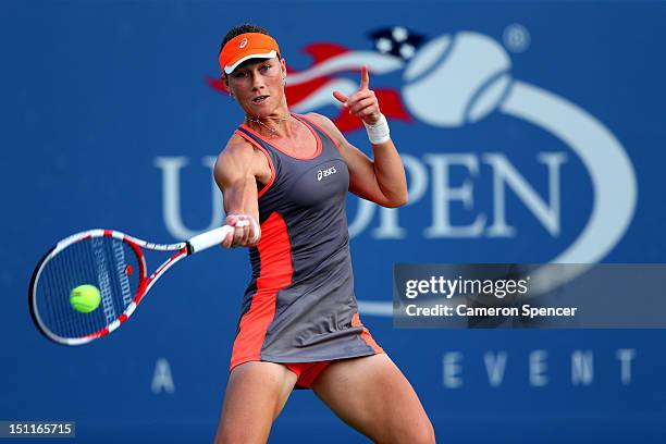 Samantha Stosur of Australia returns a shot during her women's singles fourth round match against Laura Robson of Great Britain on Day Seven of the...