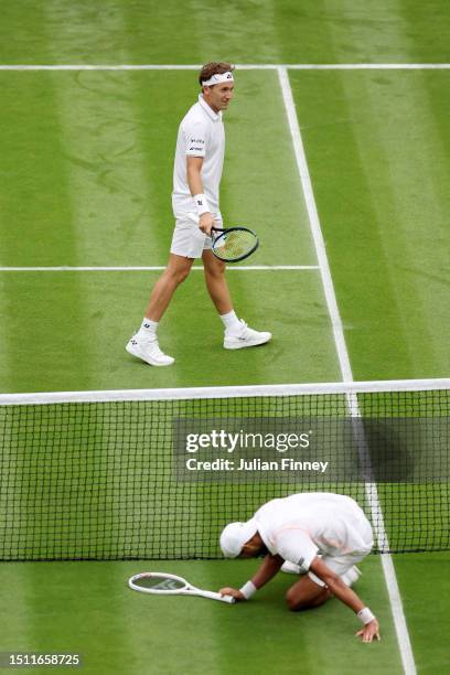 Casper Ruud of Norway celebrates as Laurent Lokoli of France falls in the Men's Singles first round match during day one of The Championships...