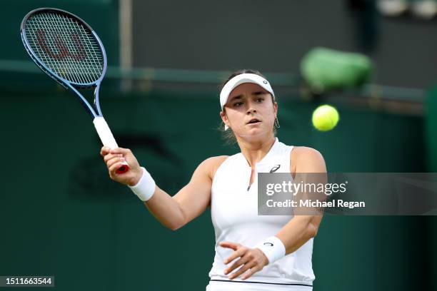 Caroline Dolehide of United States plays a forehand against Daria Kasatkina in the Women's Singles first round match on day one of The Championships...