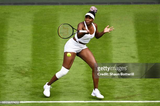 Venus Williams of United States plays a forehand against Elina Svitolina of Ukraine in the Women's Singles first round match on day one of The...