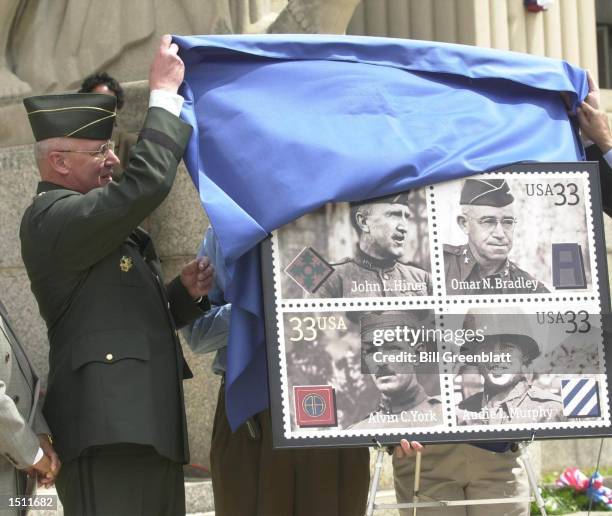 Major General Thomas Plewes, Chief of the US Army Reserves, helps to unveil the new "Distinguished Soldiers" stamp May 3, 2000 at the Soldiers...