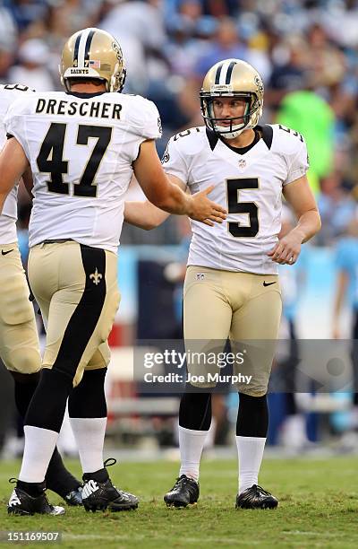 Garrett Hartley and Justin Drescher of the New Orleans Saints celebrate after making a field goal against the Tennessee Titans at LP Field on August...