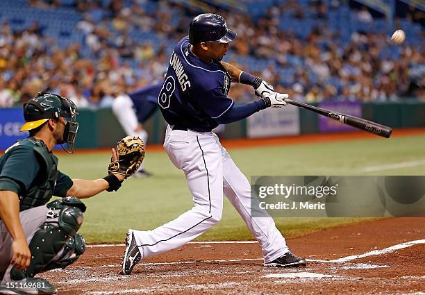 Outfielder Desmond Jennings of the Tampa Bay Rays fouls off a pitch against the Oakland Athletics during the game at Tropicana Field on August 25,...