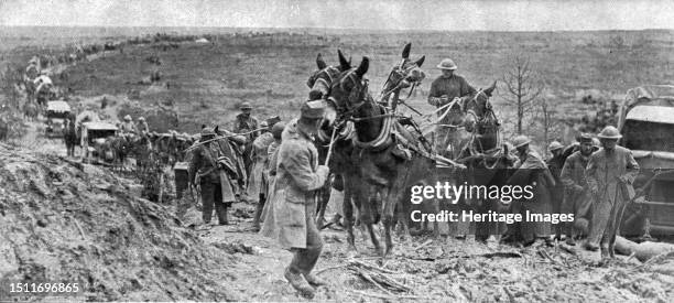 ''Les Americains dans le Saillant de Saint-Mihiel; Un convoi de munitions franchissant un passage difficile', 1918. From "L'Album de la Guerre...