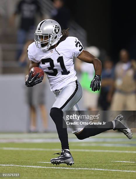 Coye Francies of the Oakland Raiders rushes against the Seattle Seahawks at CenturyLink Field on August 30, 2012 in Seattle, Washington.