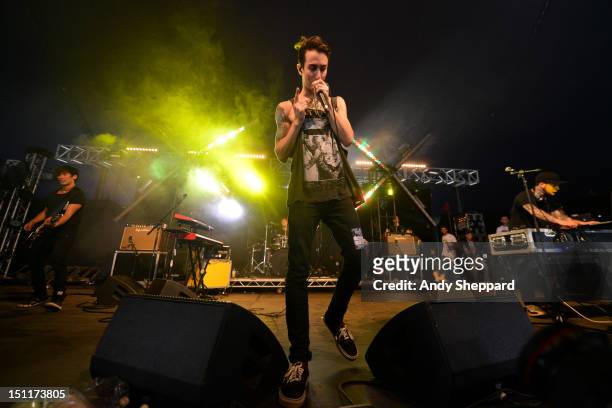 Nick Tsang, Josh Friend and Tony Friend of the band Modestep perform on stage during Reading Festival 2012 at Richfield Avenue on August 25, 2012 in...