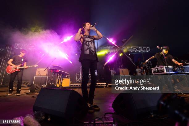 Nick Tsang, Josh Friend and Tony Friend of the band Modestep perform on stage during Reading Festival 2012 at Richfield Avenue on August 25, 2012 in...