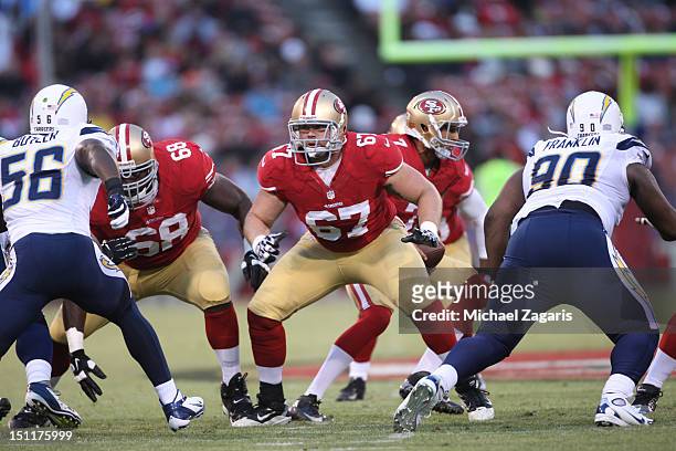 Leonard Davis and Daniel Kilgore of the San Francisco 49ers block during the game against the San Diego Chargers at Candlestick Park on August 30,...