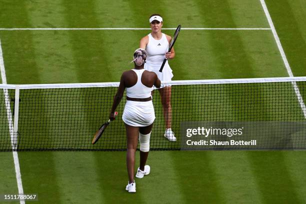 Elina Svitolina of Ukraine interacts with Venus Williams of United States after winning the Women's Singles first round match on day one of The...