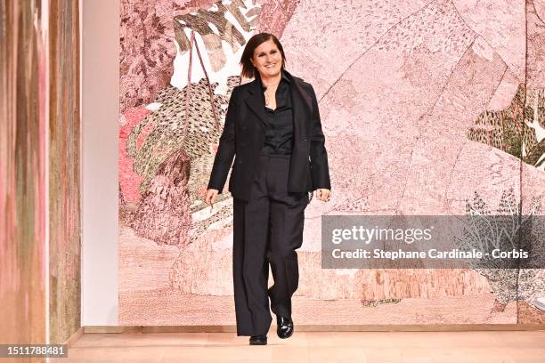 Designer Maria Grazia Chiuri acknowledges the applause of the audience after the Christian Dior Haute Couture Fall/Winter 2023/2024 show as part of...