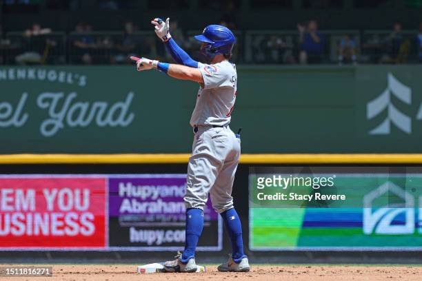 Dansby Swanson of the Chicago Cubs reacts to a double against the Milwaukee Brewers during the second inning at American Family Field on July 03,...