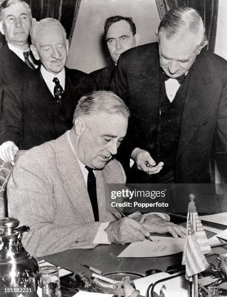 The day after the attack on Pearl Harbour United States President Franklin Delano Roosevelt signs the declaration of war against Japan in Washington...