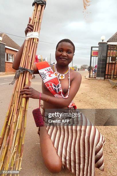 Swazi girls carries reeds on September 2, 2012 as she arrives to dance for King Mswati III at the Ludzidzini royal palace in Mbabane. Over 60,000...