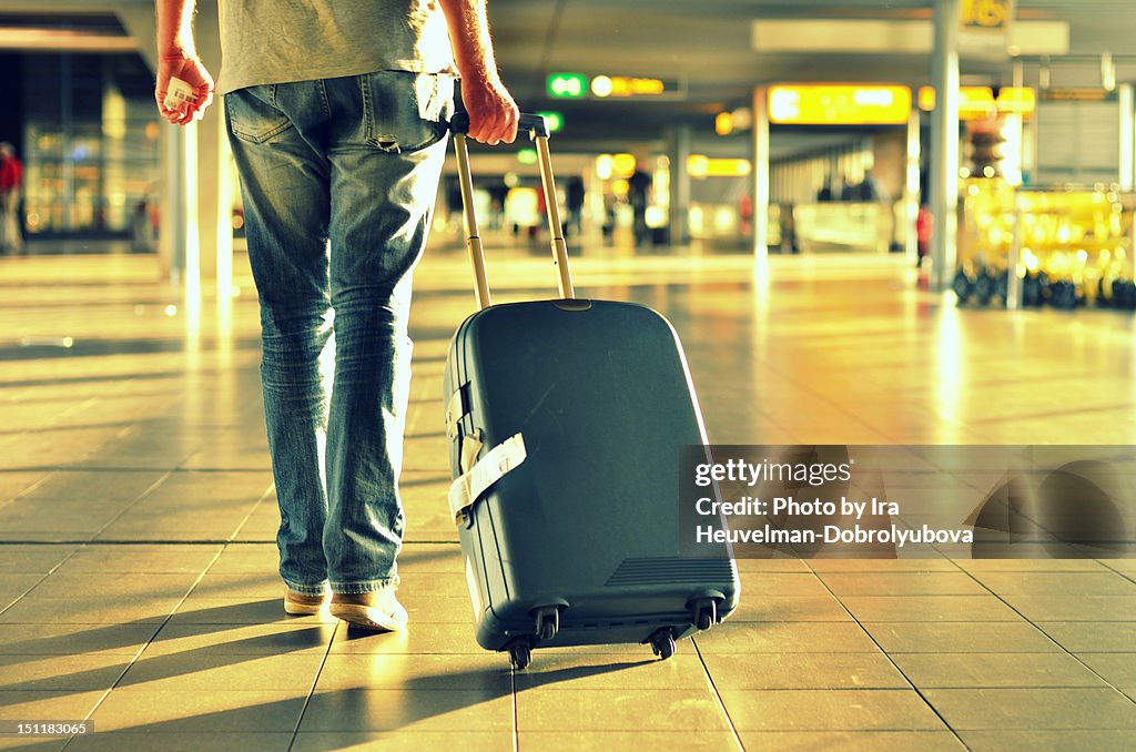 Man with suitcase walking