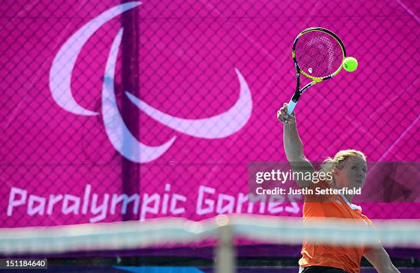 Esther Vergeer of the Netherlands serves during her Women's Singles Wheelchair Tennis match against Katharina Kruger of Germany on Day 5 of the...