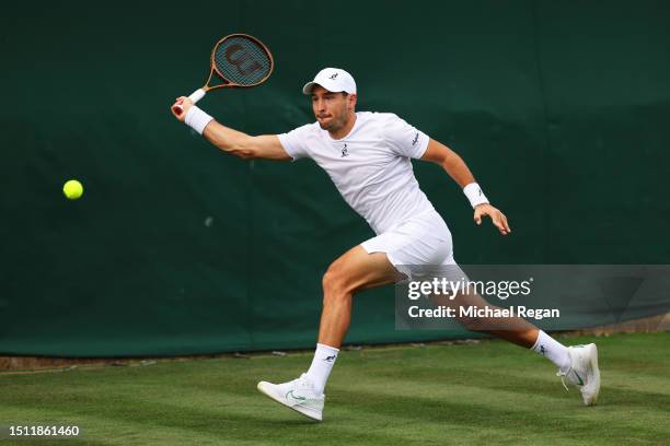 Dusan Lajovic of Serbia plays a forehand against Jan Choinski of Great Britain in the Men's Singles first round match on day one of The Championships...