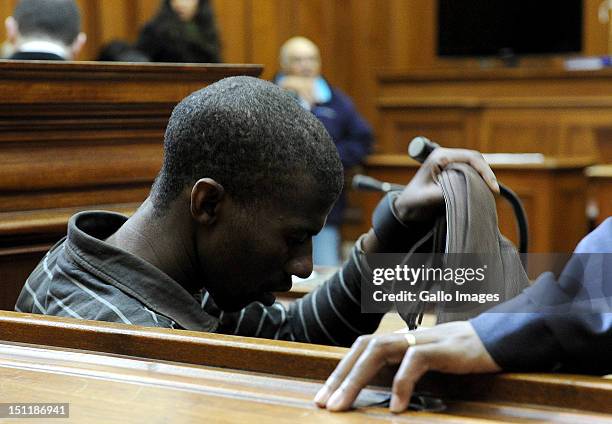 Xolile Mngeni appears at the Cape Town High Court, on September 3, 2012 in Cape Town, South Africa. He is accused of being involved in the murder of...