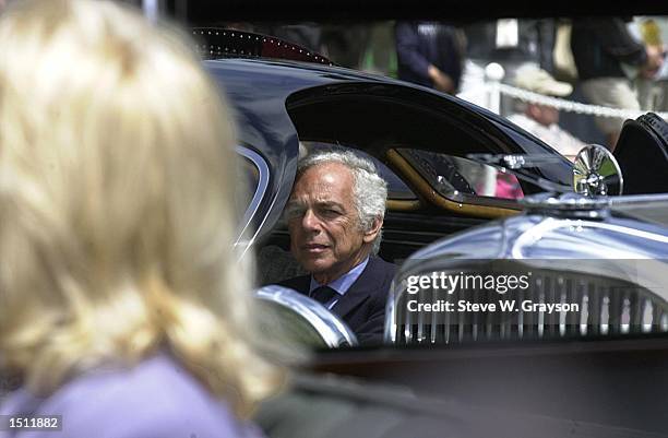 Fashion designer and car aficionado Ralph Lauren sits in his 1938 Bugatti Type 57SC Atlantic vintage automobile, winner best of show in 1990 at the...