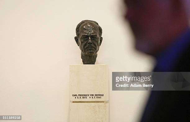 Bust of Carl Friedrich von Siemens, responsible for the resurrection of the Siemens Group after the First World War, sits on display at a Siemens...