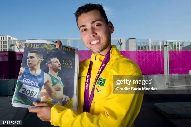 Gold medalist Alan Fonteles Cardoso Oliveira poses for a picture after winning the gold medal of the Men's 200m - T44 race on day 5 of the London...