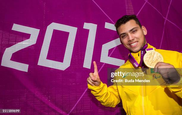 Gold medalist Alan Fonteles Cardoso Oliveira poses for a picture after winning the gold medal of the Men's 200m - T44 race on day 5 of the London...